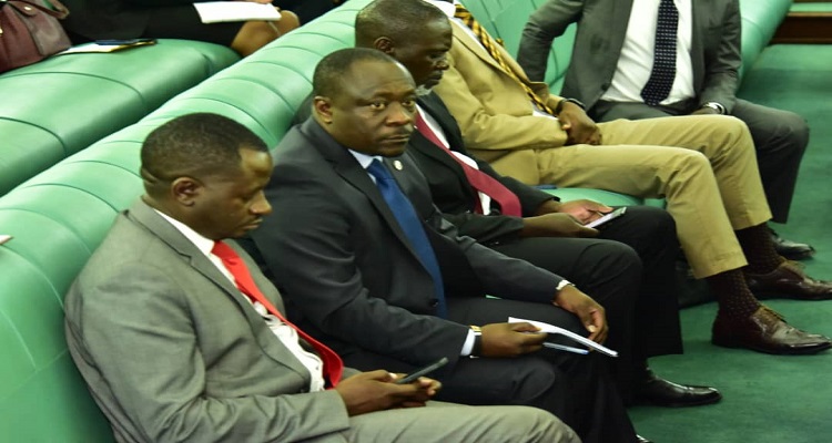 hon. Mwijukye (2nd L) after he presented his concern on the Floor of Parliament